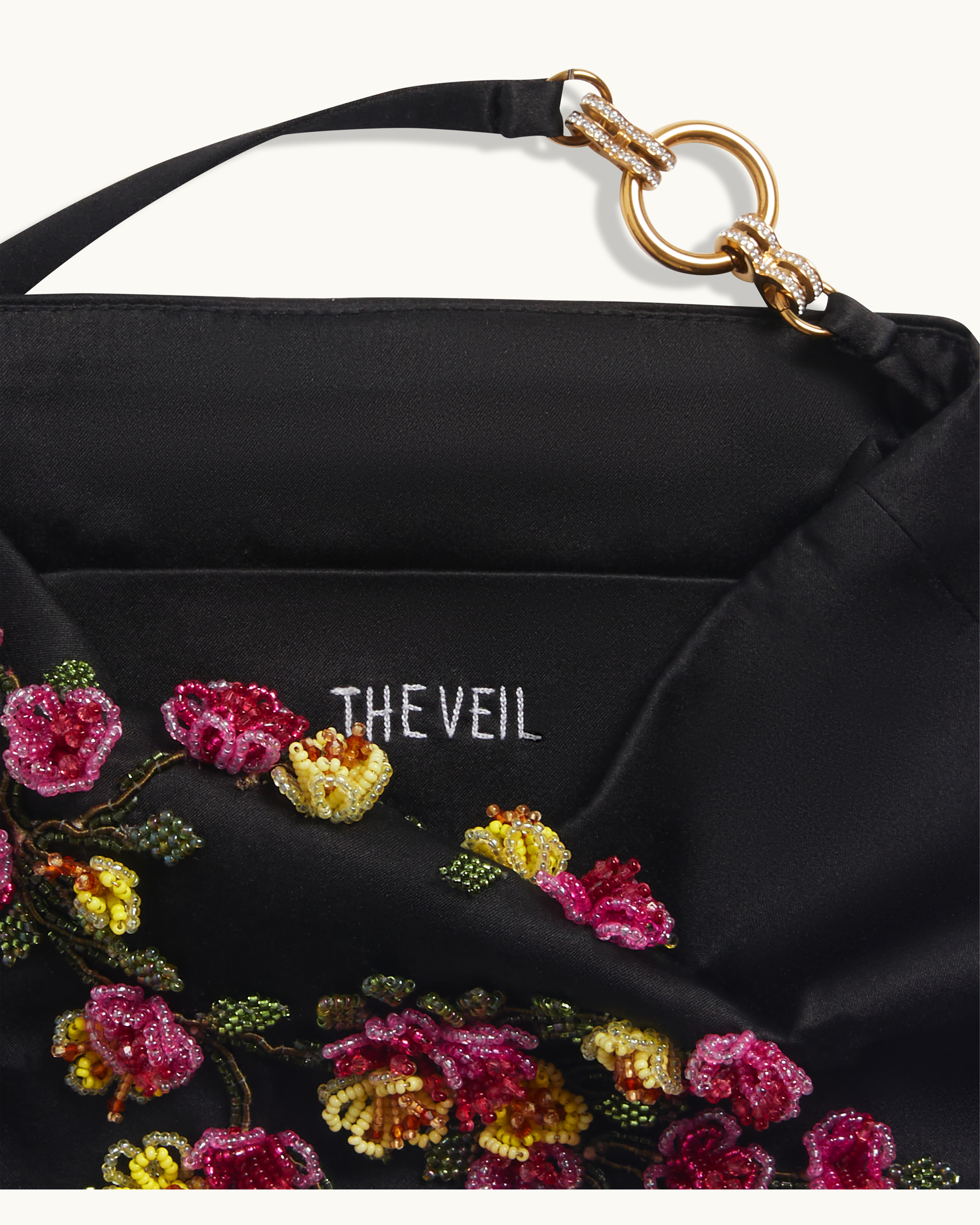 Interior lining of The Veil Pocket Hana Bag in black silk satin