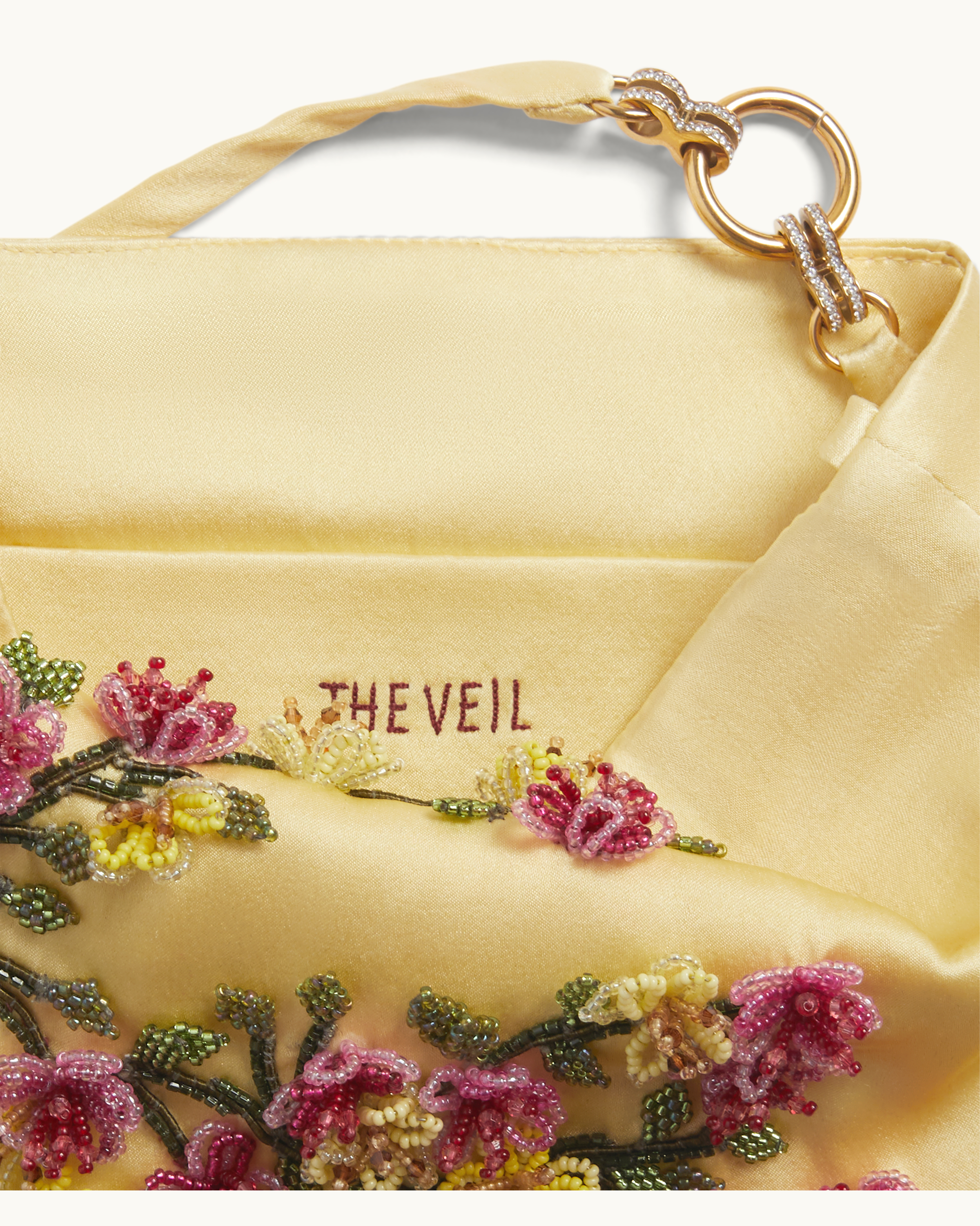 Interior lining of The Veil Pocket Hana Bag in yellow silk satin